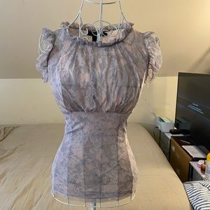 ARDEN B Blouse. Colors are soft comprising pink and grey.